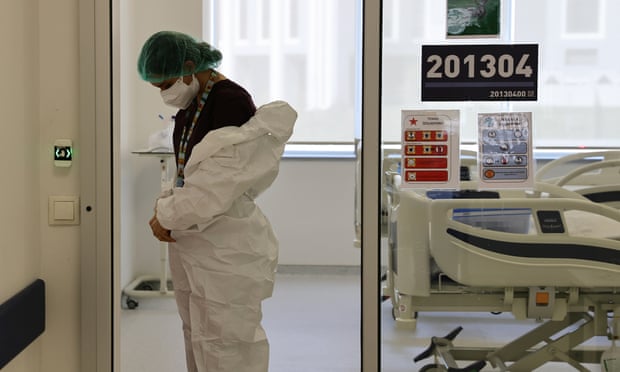 A health official prepares to treat a coronavirus patient in the Covid-19 intensive care unit of Ankara City Hospital in Turkey.
