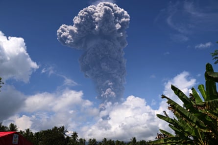 Thick grey ash and dark clouds spew from Mount Ibu on 15 May 2024.