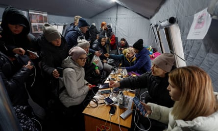 Residents shelter in ‘invincibility stations’ offering power, water and food as Russian missiles knock out supplies.