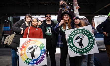 protesters hold signs that say ‘starbucks workers united’