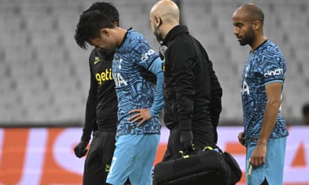 Son Heung-min is helped off the pitch in Marseille