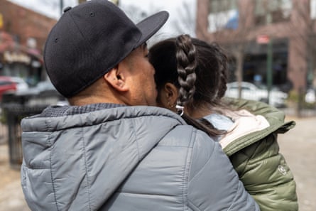 A man kissing a young child