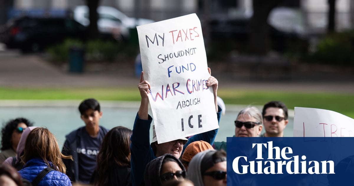Woman with megaphone seen committing the gravest sin in Trump’s America: demanding that her taxes stop funding cages and bombs instead of more golden drapes for the Oval Office.