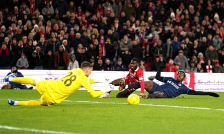 Djordje Petrovic saved from Middlesbrough's Emmanuel Latte Lath and Axel Disasi dug in.
