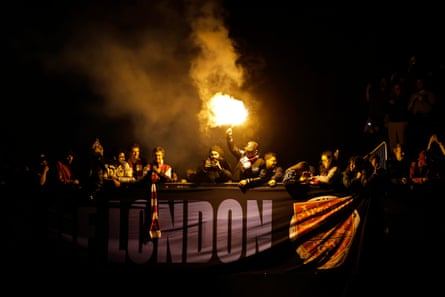 Arsenal fans celebrate winning the Premier League outside the Emirates Stadium