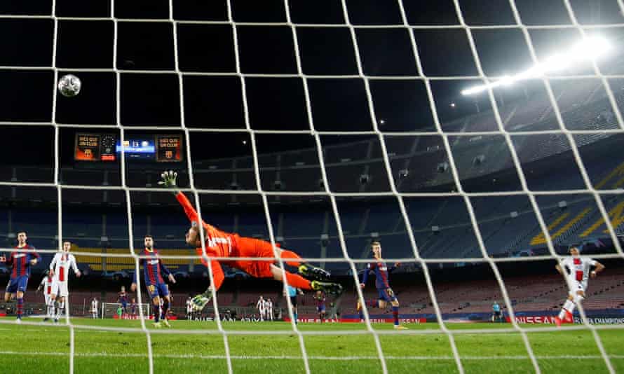 Paris St Germain’s Kylian Mbappe curls the ball past Barcelona’s keeper Marc-Andre Ter Stegen for his hat-trick.