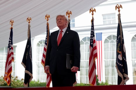 Trump standing for photos.
