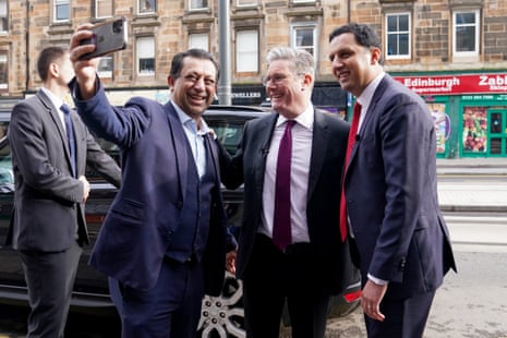 Foysol Choudhury poses for a selfie with Keir Starmer, then leader of the Labour party, and Anas Sarwar outside the Turkish earthquake appeal aid depot in Edinburgh in February 2023.