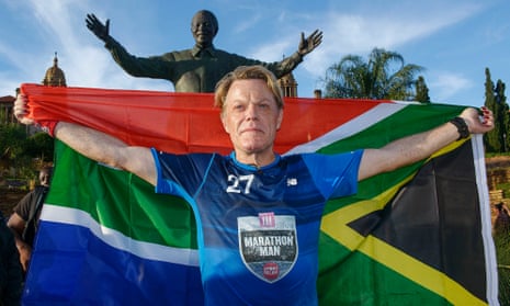 Izzard at the Nelson Mandela statue at the government’s Union Buildings in Pretoria, South Africa, after finishing his Sport Relief challenge.