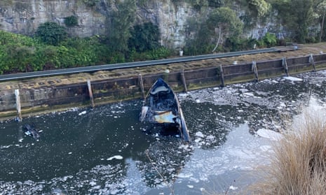 The remains of a luxury vessel at Woolwich pier in Sydney. Police are investigating after it was destroyed by fire on Saturday night.