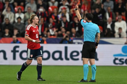 Pavel Sulc (left) is shown a red card by Halil Meler for a foul on Elliot Anderson.