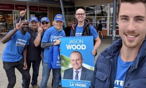 Volunteers for the Liberal MP Jason Wood with an election poster devoid of the party’s branding