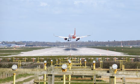 An easyJet Airbus Acomes in to land at Gatwick Airport on a windy day.