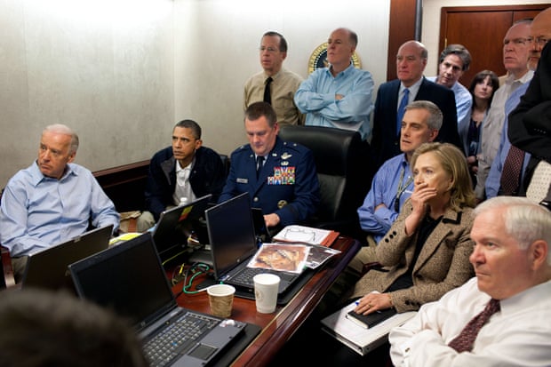 A photo taken on 1 May 2011 shows Barack Obama, Joe Biden and aides as they receive an update on the mission against Osama bin Laden in the Situation Room of the White House.