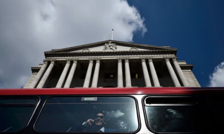 A bus passes the Bank of England in the City of London.