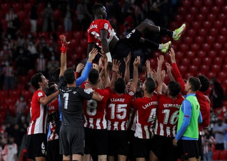 Iñaki Williams is hoisted in the air by his teammates after breaking a La Liga record by playing 203 consecutive matches.