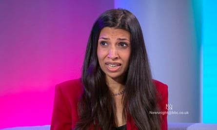 Faiza Shaheem speaking against a pink, purple and blue background