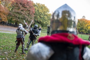 Members of Gladiators NYC league dressed in medieval armour fight each other in Central Park