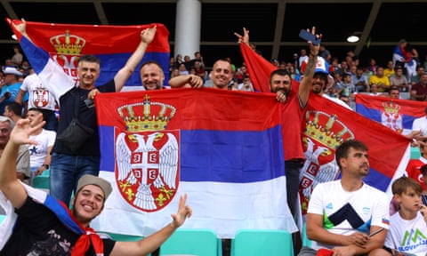 Serbia fans with flags inside the stadium