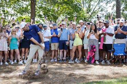 Scottie Scheffler hits out of the rough on the 1st hole during the final round.
