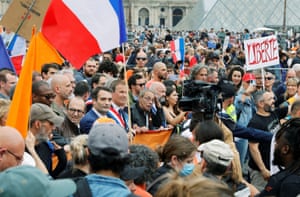Right wing politicians attend a march in Paris against a planned Covid-19 passport and obligatory vaccinations for health workers