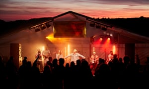 Band perform on stage, at night, Top of the Gorge Festival, Somerset, UK.