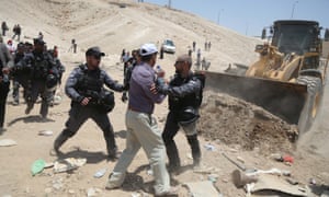 Israeli security forces intervene as Palestinians try to save their homes from demolition in Khan al-Ahmar.
