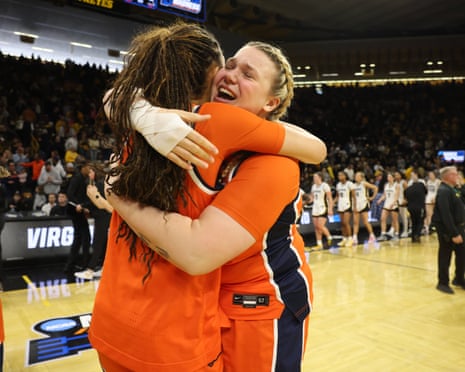 The Virginia Cavaliers women's basketball team celebrating their upset victory over Iowa