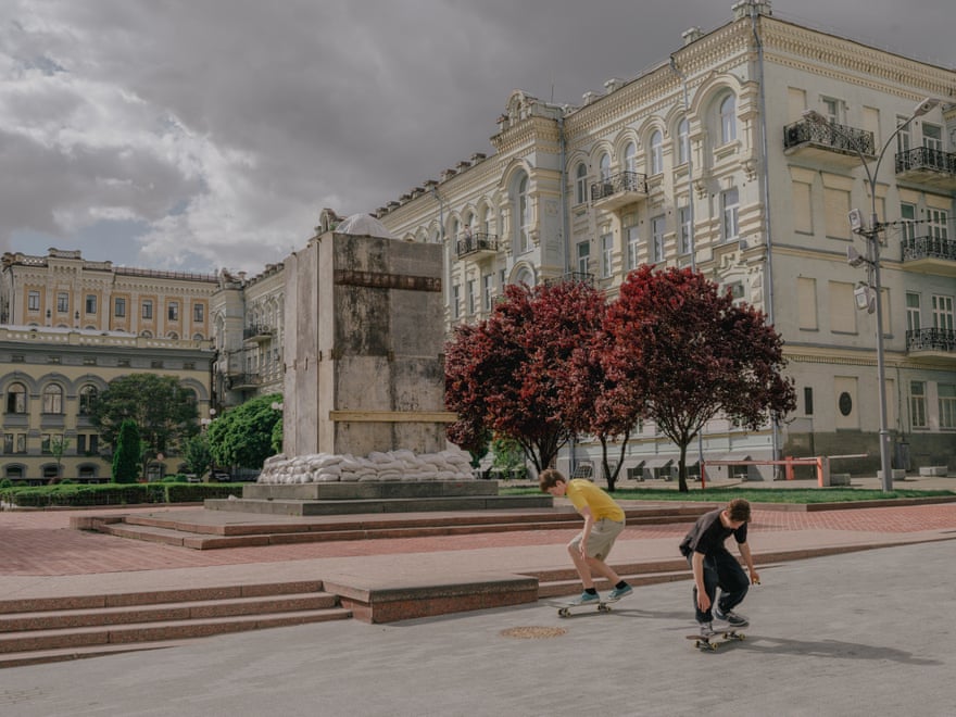Young skateboarders practice Kyiv Opera.