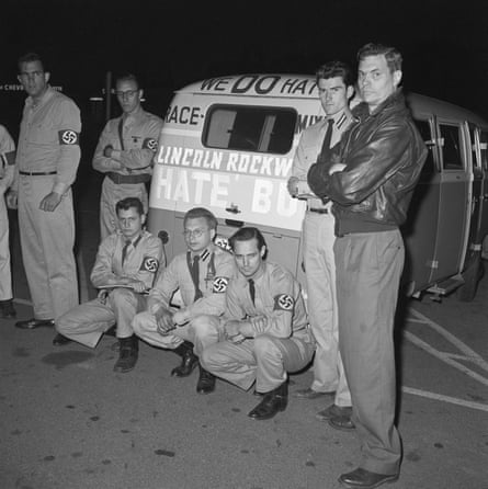 George Lincoln Rockwell and followers of his American Nazi party pose next to the Hate Bus