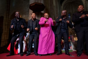2013: Tutu (centre) celebrating with the Cape Town Opera Ensemble at the Templeton prize ceremony at St George’s Cathedral