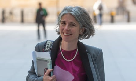Rain Newton-Smith in a London square; she is holding notebooks and paperwork