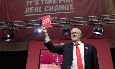 Jeremy Corbyn holds a copy of the manifesto on stage at the launch of Labour’s General Election manifesto, at Birmingham City University, 2019.