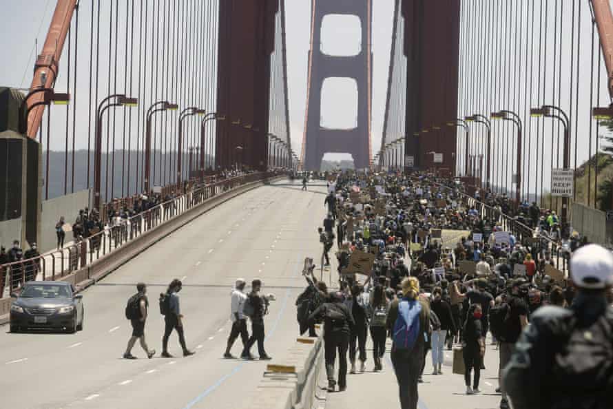 Demonstrators spanned the Golden Gate Bridge in San Francisco on Saturday.