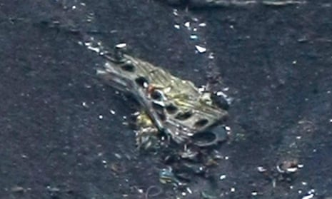 Debris of the crashed Germanwings passenger jet is scattered on the mountain side.