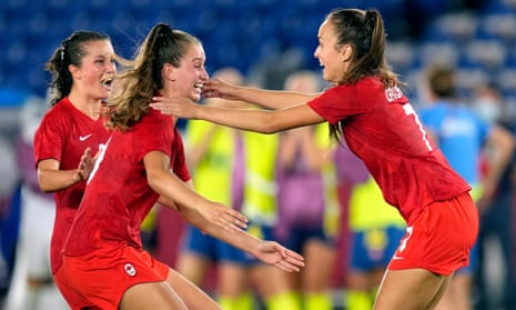 Julia Grosso celebrates with teammates after scoring the decisive penalty as Canada beat Sweden to win Olympic gold