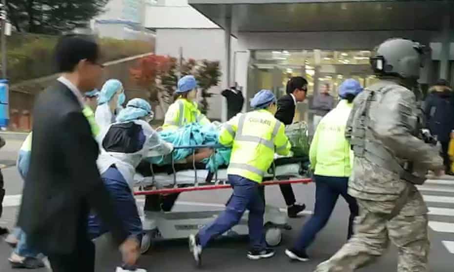 The wounded North Korean soldier is rushed to hospital after being shot while defecting to South Korea.