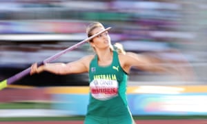 Kelsey-Lee Barber of Australia is running down the track with her arm back about to throw her javelin in the women’s javelin final at the World Athletics Championships, the stadium and crowd are blurred behind her