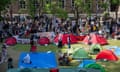 Protesters listen to speeches in front of the pro-Palestinian campsite at the School of Oriental and African Studies (SOAS) in London on 11 May 2024.
