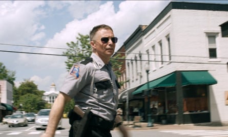 Officer Jason Dixon, played by Sam Rockwell on Main Street, Sylva, in a scene from Three Billboards.