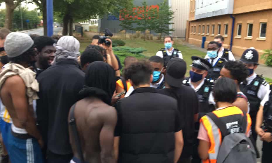 Protesters and police outside Colindale police station