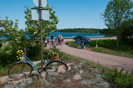 adult cyclists along a country road Aland, Mariehamn Finland