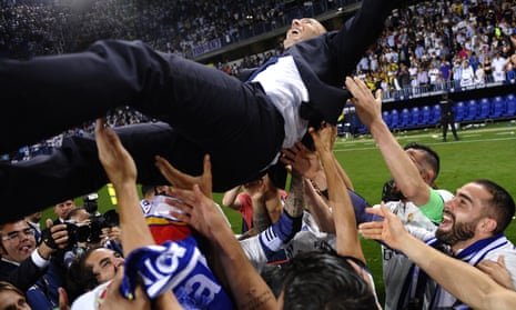 Real Madrid’s head coach Zinedine Zidane is thrown into the air by his players after winning the title.