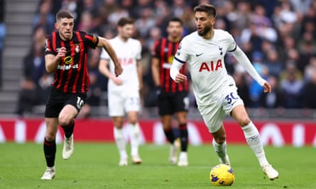 Rodrigo Bentancur of Tottenham Hotspur is chased by Ryan Christie of Bournemouth