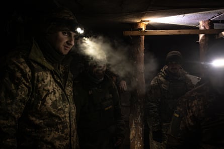 A group of Ukrainian soldiers sets up a new position in a bunker near the frontline of Bakhmut.