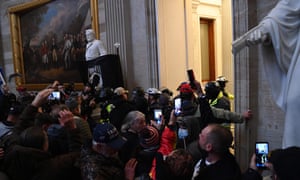 A mob breaks into the Rotunda of the US Capitol as Congress debates the certification of the electoral vote for the 2020 presidential election.