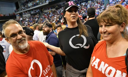 QAnon supporters await the arrival of Donald Trump for a rally at Mohegan Sun Arena in Wilkes-Barre, Pennsylvania, in 2018.