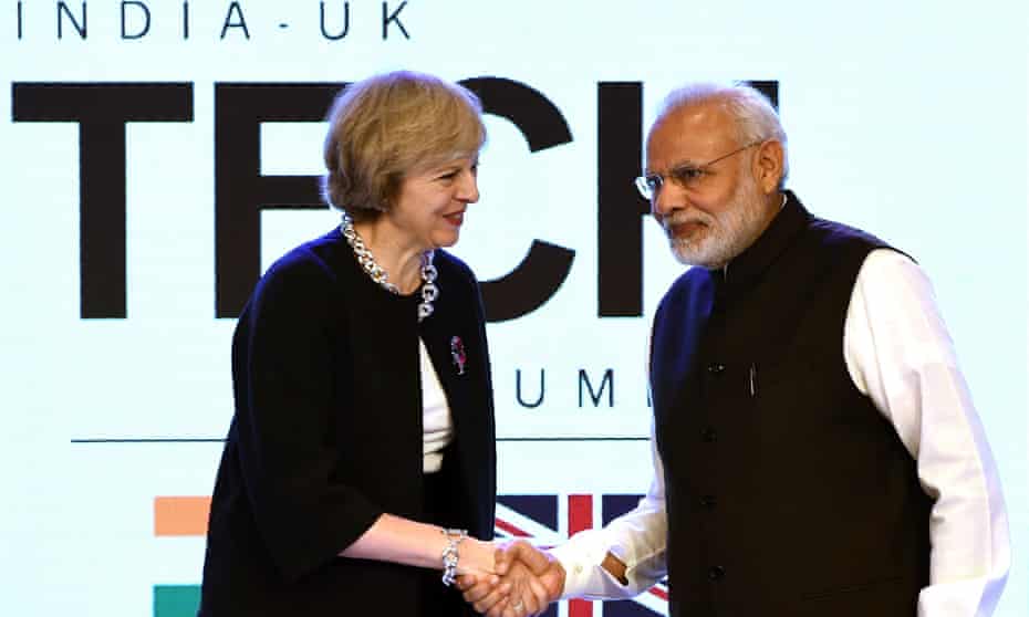 Britain’s prime minister, Theresa May, shakes hands with India’s prime minister, Narendra Modi, at the India-UK tech summit in New Delhi.