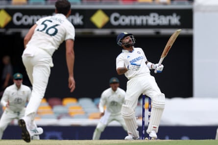 Kohli wears a Mitchell Starc delivery that reared up on him.