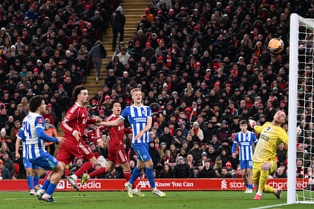 Curtis Jones watches the ball fly high into the Brighton net